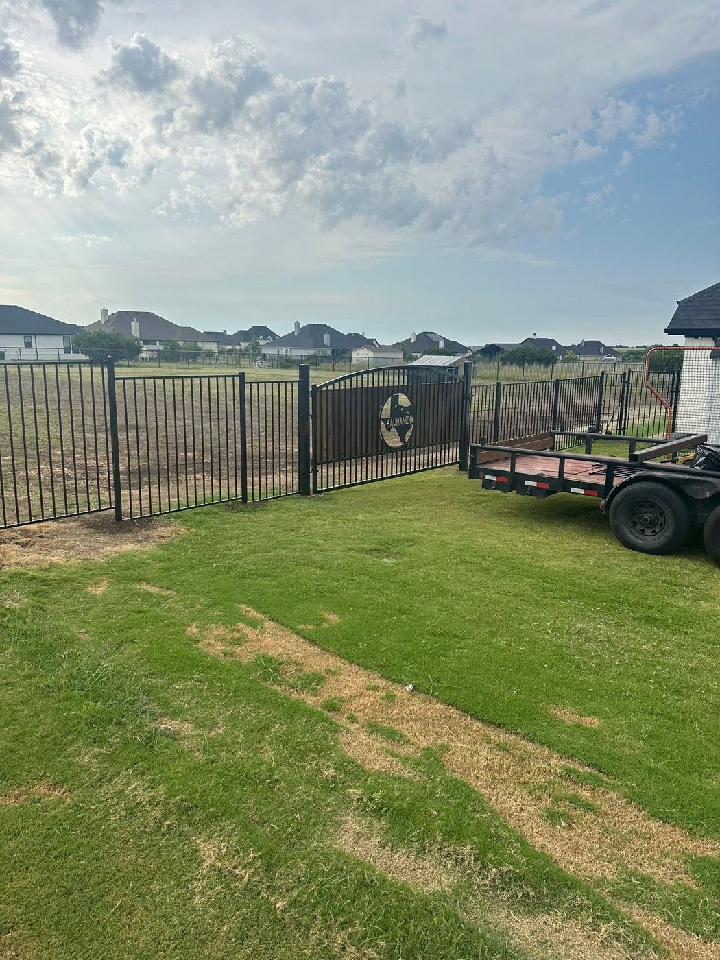 Custom ornamental gate with a personalized Texas medallion