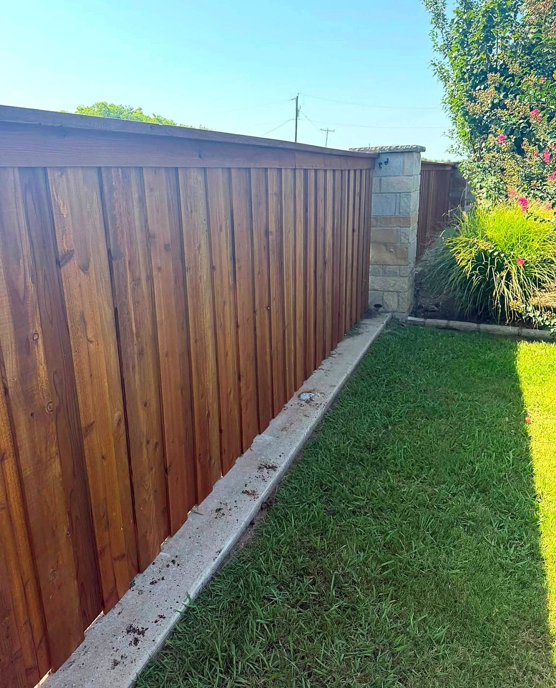 Close-up of wood fence board detail along walkway