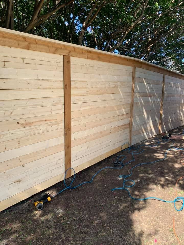 Freshly built horizontal-plank wood fence