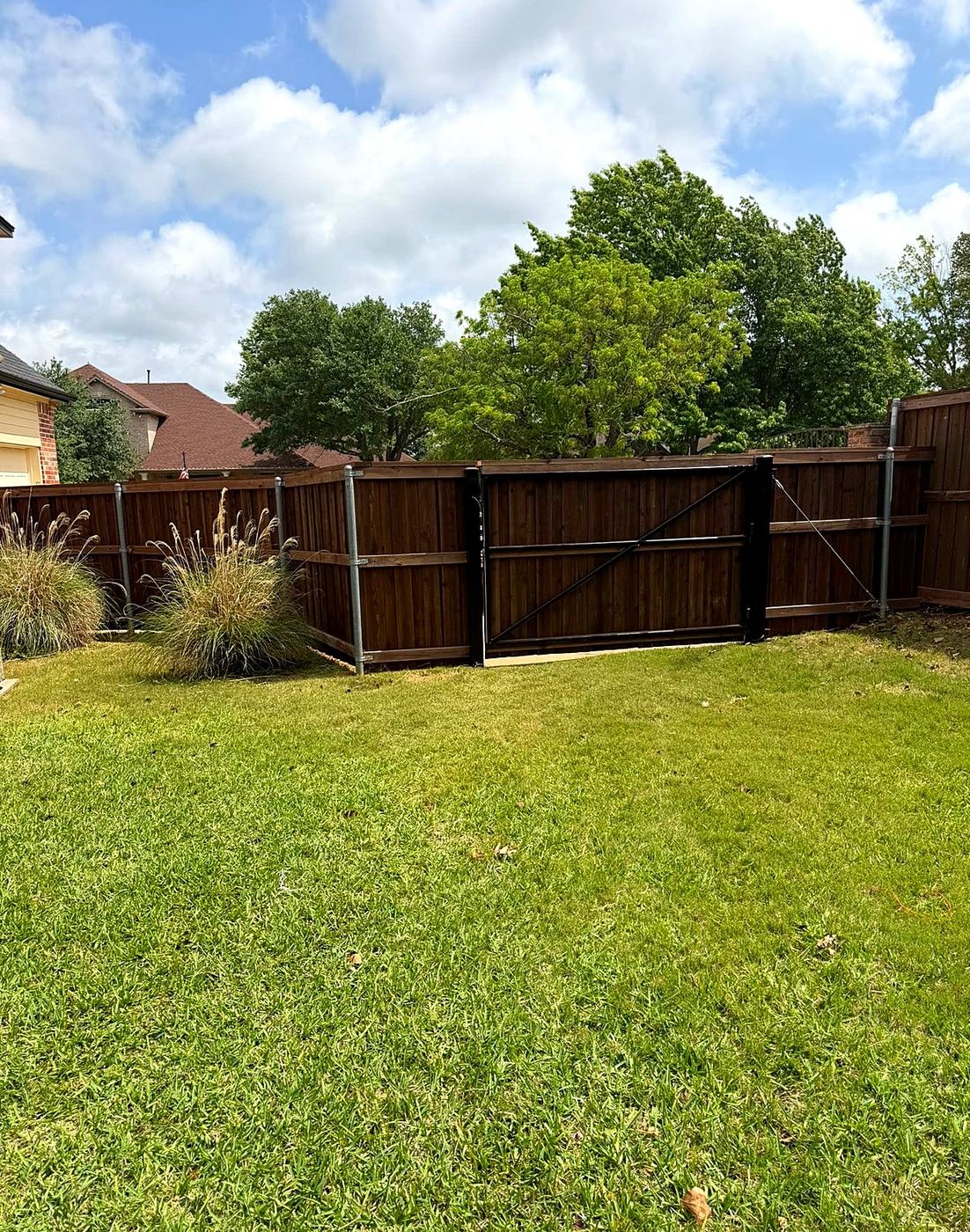 Wood fence and gate with landscaping