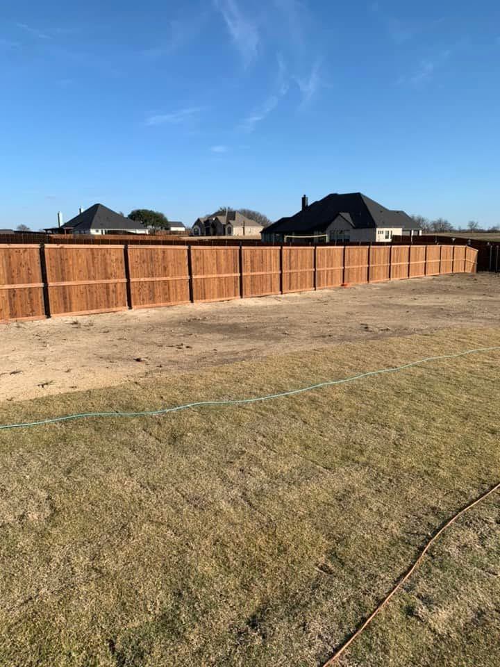 Wood privacy fence around a new construction property